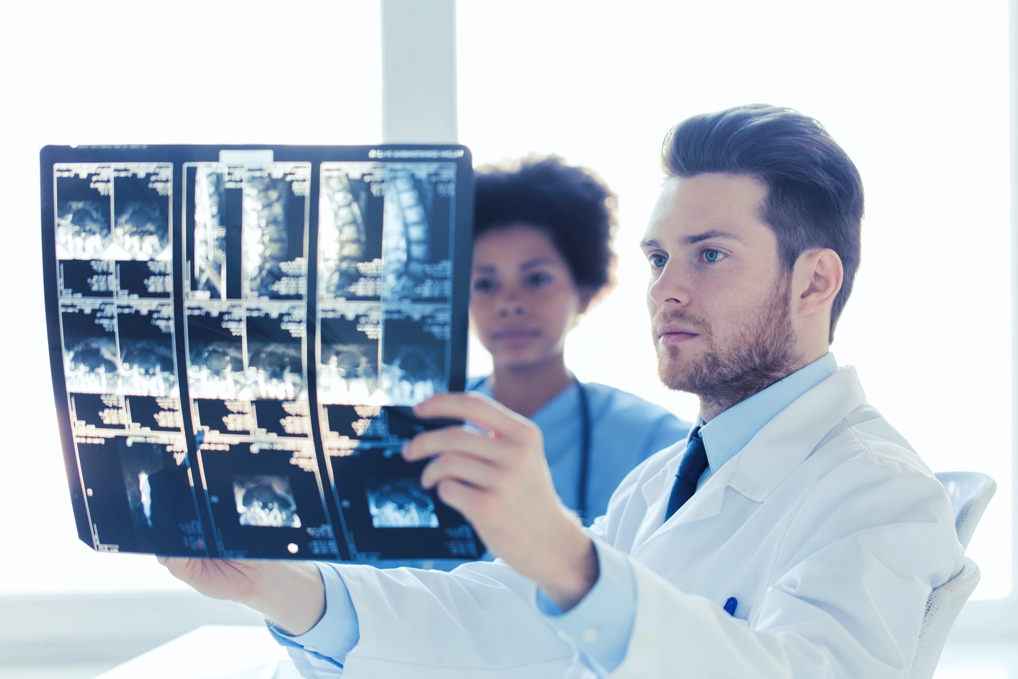doctor and nurse looking to x-ray at hospital