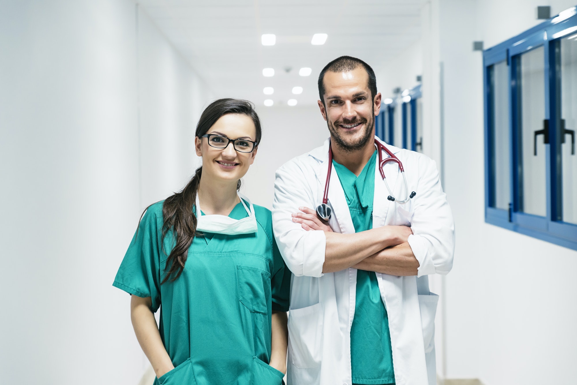 Smiling doctor and nurse portraiture.